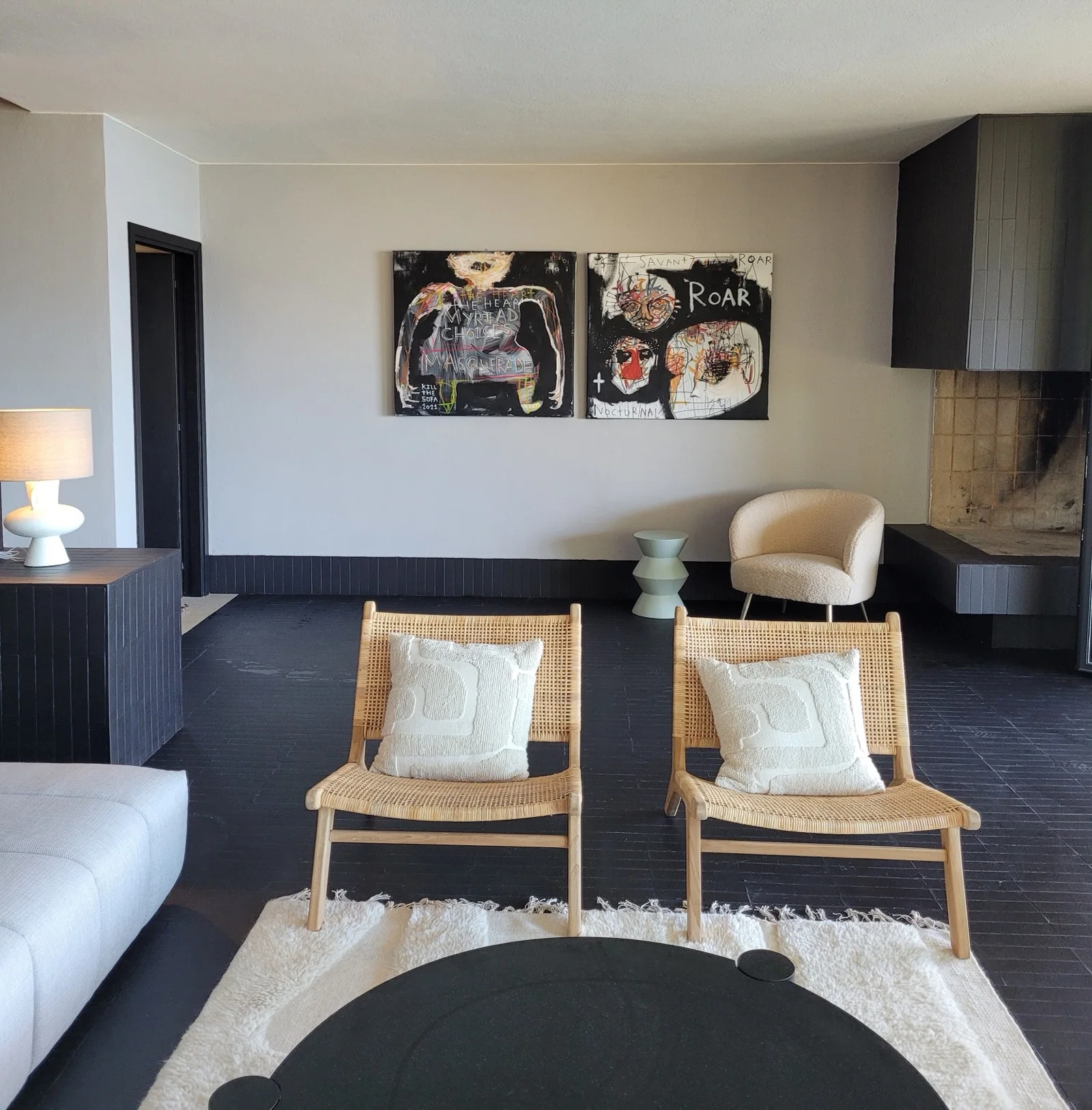 Living room with fireplace and art